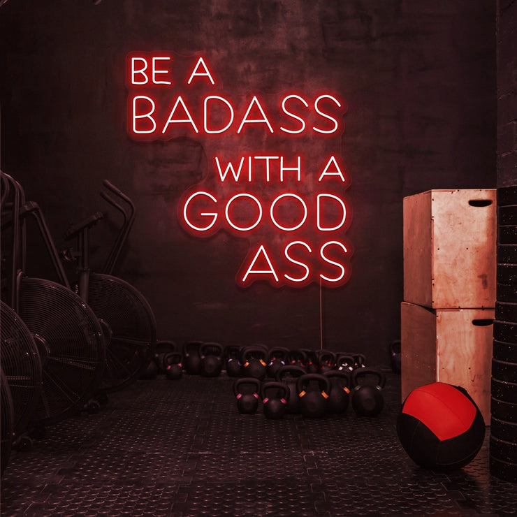 red be a badass with a good ass neon sign hanging on gym wall