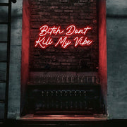red bitch don't kill my vibe neon sign hanging on bar wall