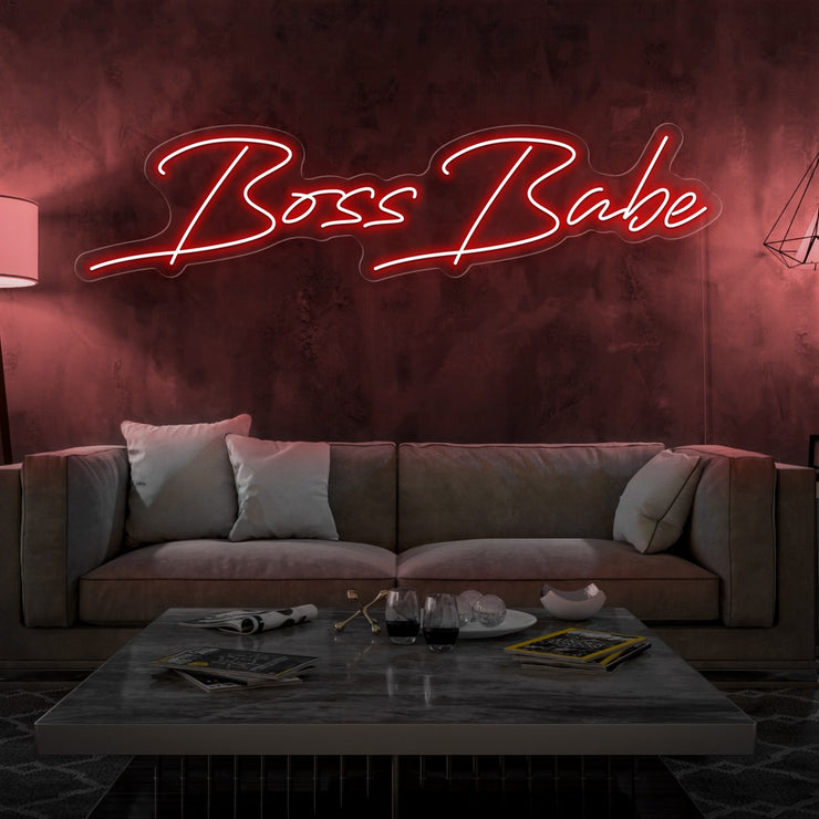 red boss babe neon sign hanging on living room wall