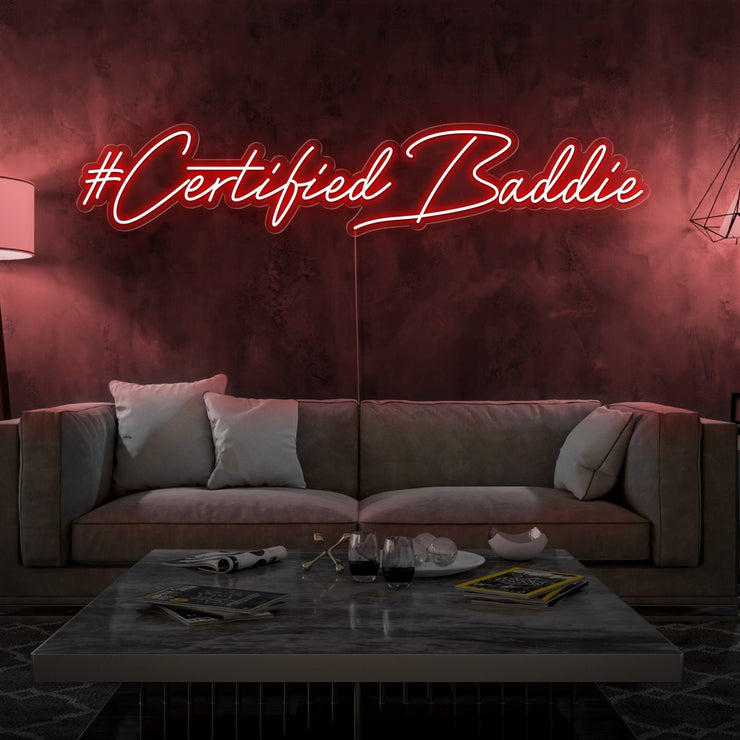 red certified baddie neon sign hanging on living room wall