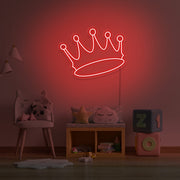 red crown neon sign hanging on kids bedroom wall