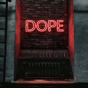 red dope neon sign hanging on bedroom wall