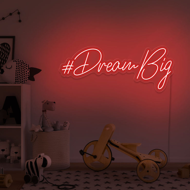 red dream big neon sign hanging on kids bedroom wall