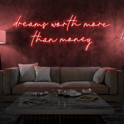 red dreams worth more than money neon sign hanging on living  room wall