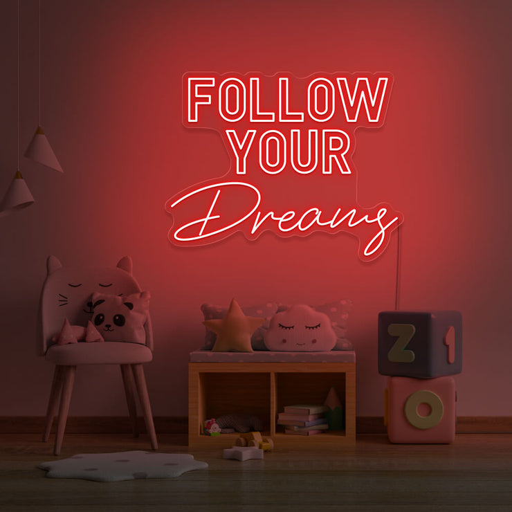 red follow your dreams neon sign hanging on kids bedroom wall