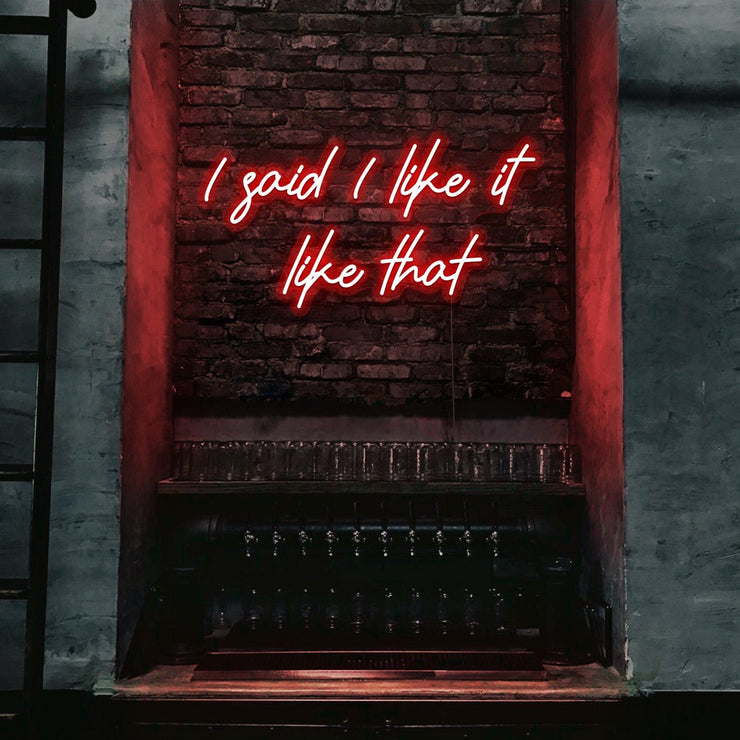 red i said i like it like that neon sign hanging on bar wall