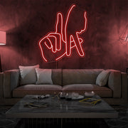 red LA fingers neon sign hanging on living room wall