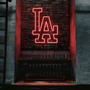 red LA neon sign hanging on bar wall