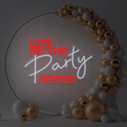 red lets get this party started neon sign hanging in gold hoop frame