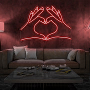 red love hands neon sign hanging on living room wall