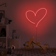 red love heart neon sign hanging on kids bedroom wall