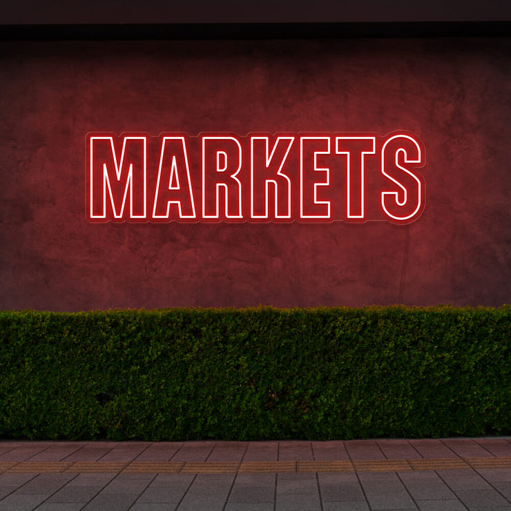 red markets neon sign hanging on outside wall