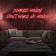 red scared money dont make no money neon sign hanging on living room wall