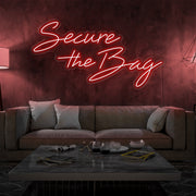 red secure the bag neon sign hanging on living room wall