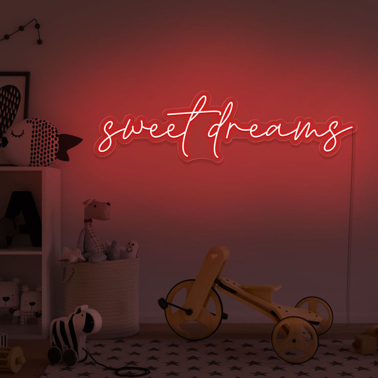 red sweet dreams neon sign hanging on kids bedroom wall