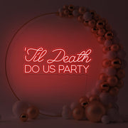 red til death do us party neon sign in gold hoop backdrop with balloons