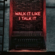 red walk it like i talk it neon sign hanging on bar wall