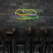 sandwich neon sign hanging on restaurant wall