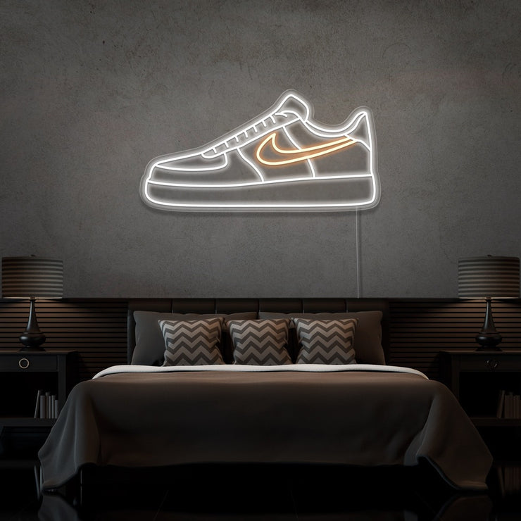 warm white air force 1 nike sneaker neon sign hanging on bedroom wall
