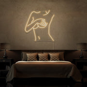 warm white cover up neon sign hanging on bedroom wall
