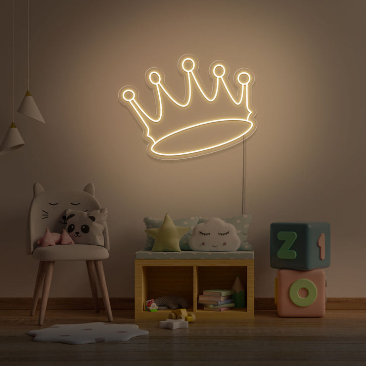 warm white crown neon sign hanging on kids bedroom wall