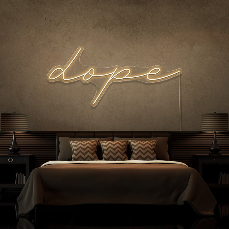 warm white dope cursive neon sign hanging on bedroom wall