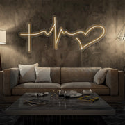 warm white faith hope and love neon sign hanging on living room wall