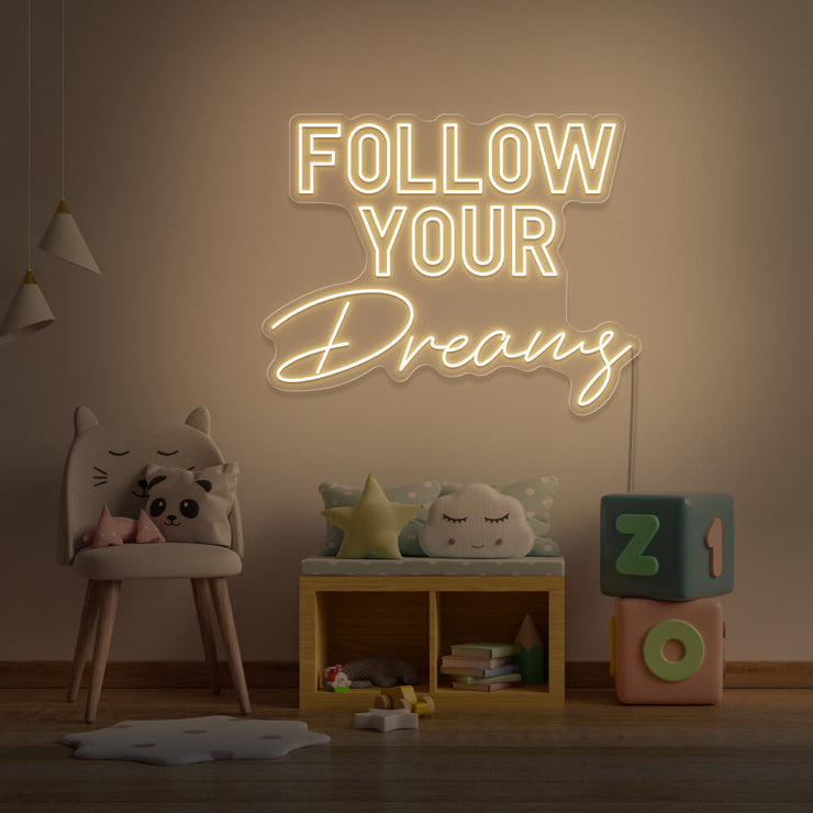 warm white follow your dreams neon sign hanging on kids bedroom wall