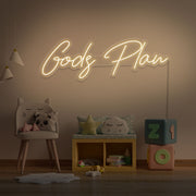 warm white Gods plan neon sign hanging on kids bedroom wall