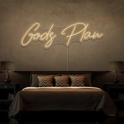 warm white gods plan neon sign hanging on bedroom wall