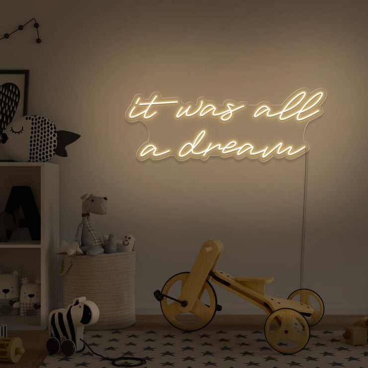 warm white it was all a dream neon sign hanging on kids bedroom wall