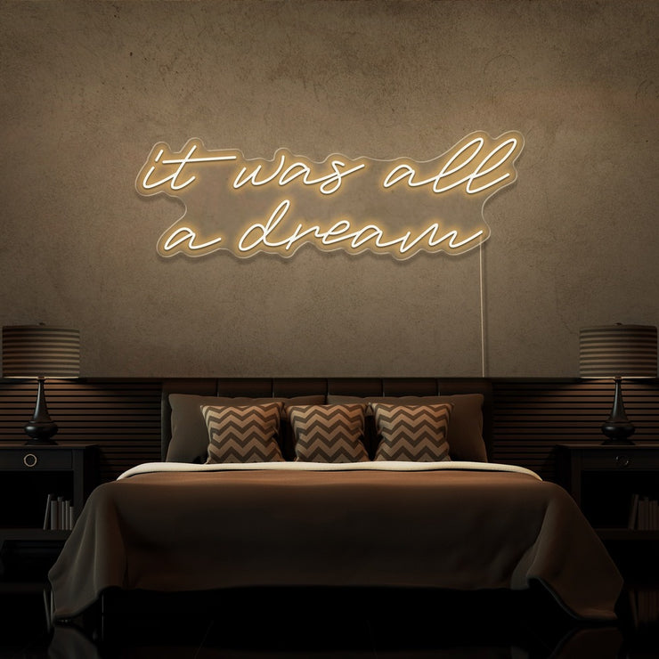warm white it was all a dream neon sign hanging on bedroom wall