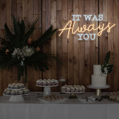 warm white it was always you neon sign hanging above dessert table