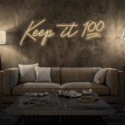 warm white keep it 100 neon sign hanging on living room wall