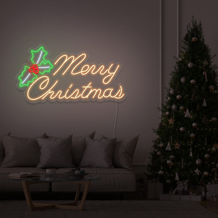 warm white merry chirstmas mistletoe neon sign hanging above couch next to christmas tree