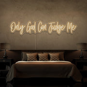 warm white only god can judge me neon sign hanging on bedroom wall