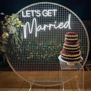 lets get married wedding neon sign on white mesh backdrop frame