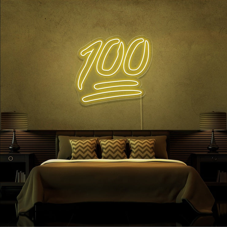 yellow 100 neon sign hanging on bedroom wall
