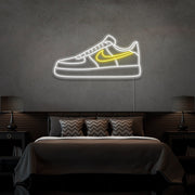 yellow air force 1 nike sneaker neon sign hanging on bedroom wall