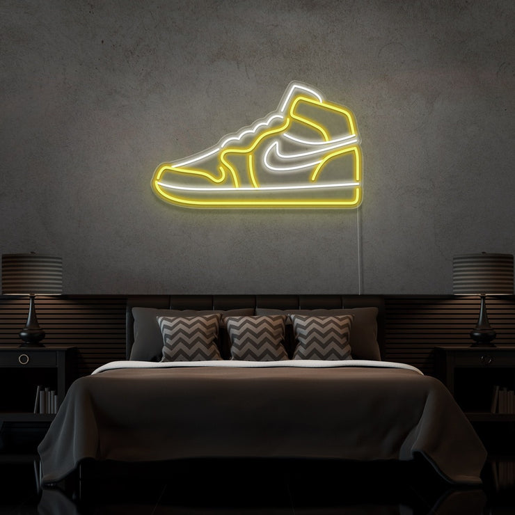 yellow air jordan 1 sneaker neon sign hanging on bedroom wall
