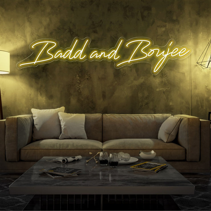 yellow bad and boujee neon sign hanging on living  room wall