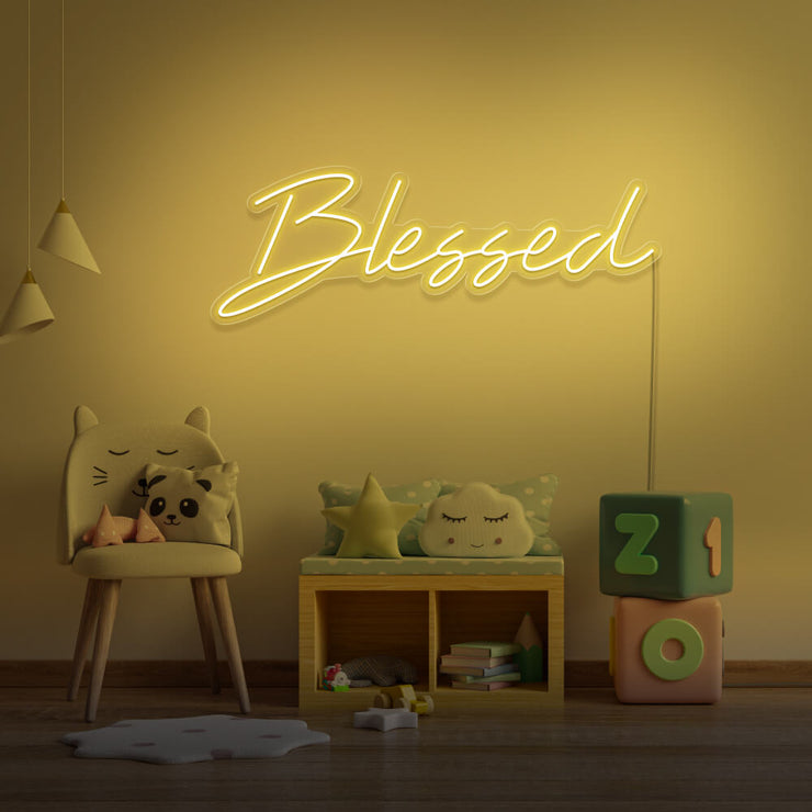 yellow blessed neon sign hanging on kids bedroom wall
