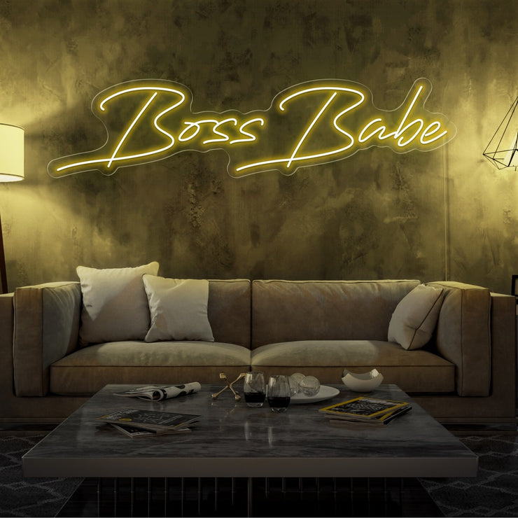 yellow boss babe neon sign hanging on living  room wall
