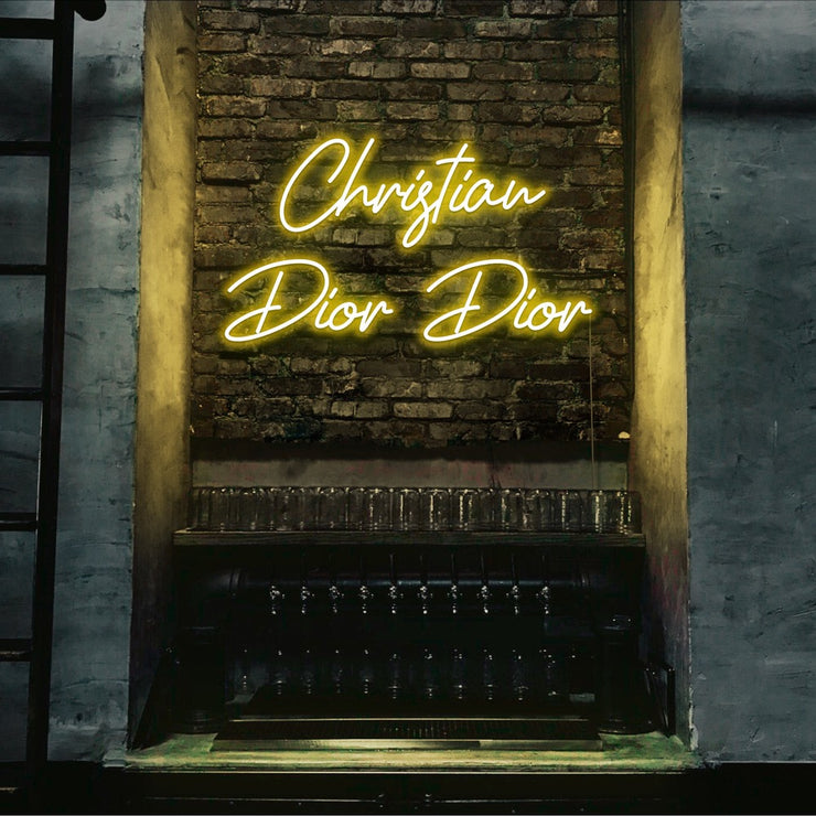 yellow christian dior dior neon sign hanging on bar wall