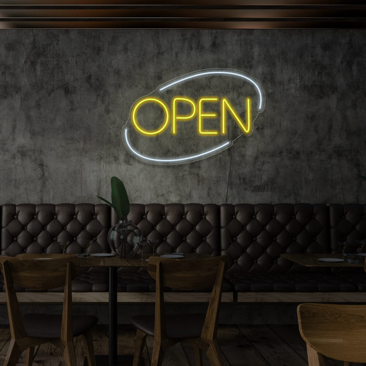 yellow open neon sign hanging on restaurant wall