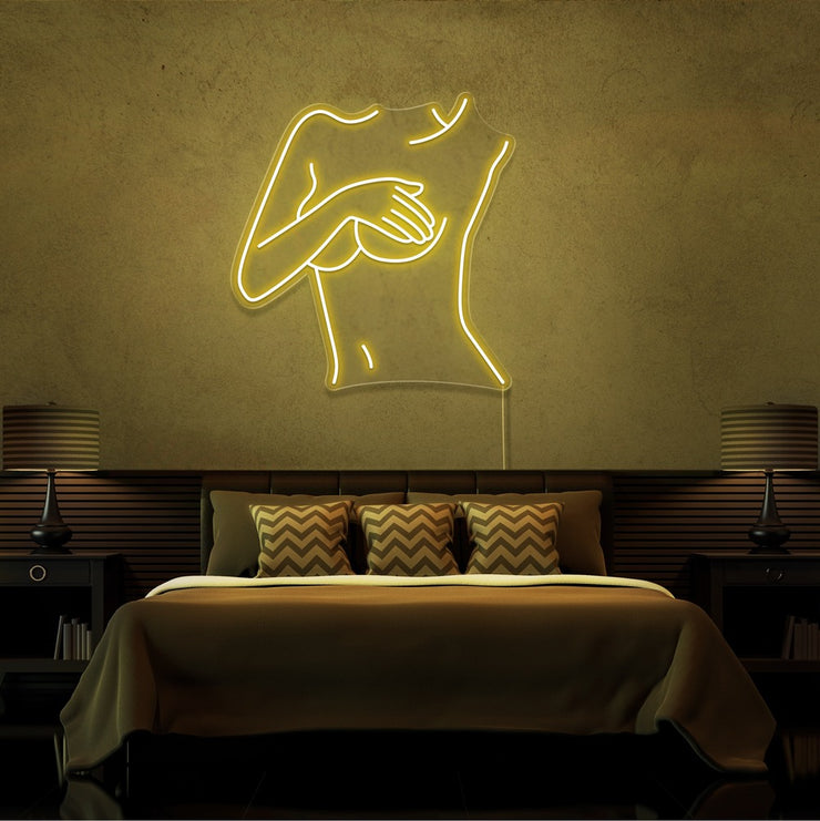 yellow cover up neon sign hanging on bedroom wall