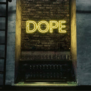 yellow dope neon sign hanging on bedroom wall
