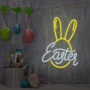 yellow easter bunny neon sign hanging on wall