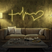 yellow faith hope and love neon sign hanging on living room wall