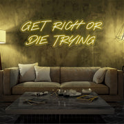 yellow get rich or die trying neon sign hanging  on living room wall